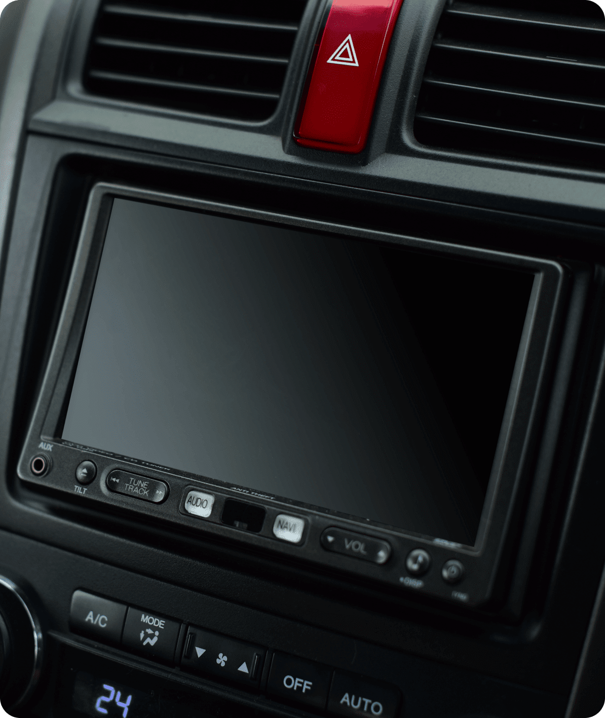 A car stereo with the radio on.