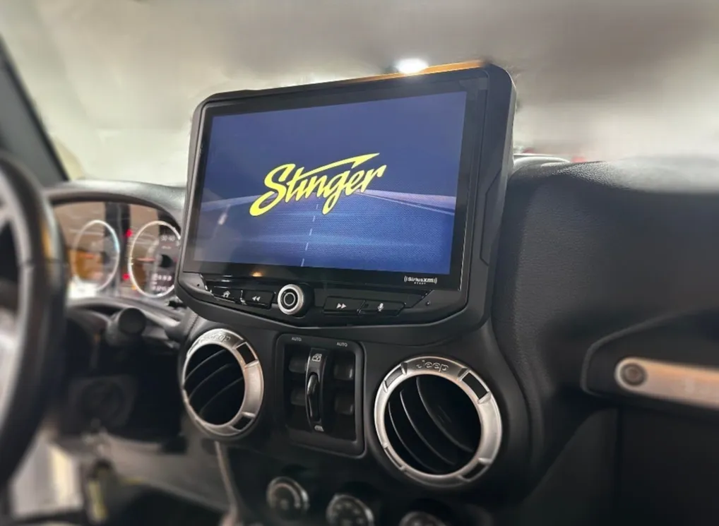 A close up of the dashboard with a tablet